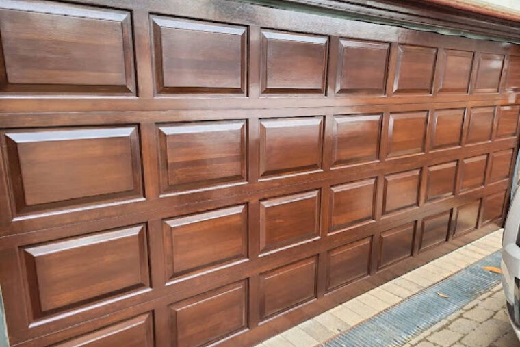 This is a garage door with a dark wood finish.