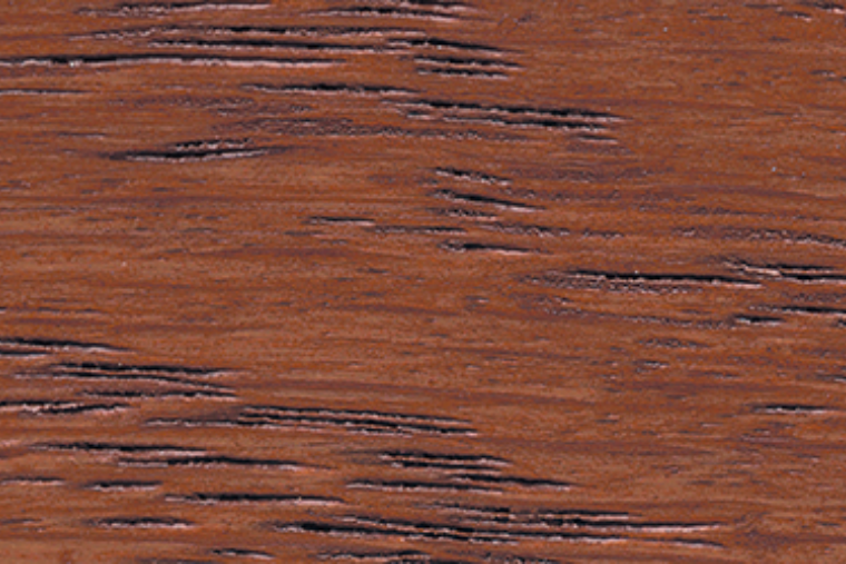 A close-up image of a reddish wood stain.