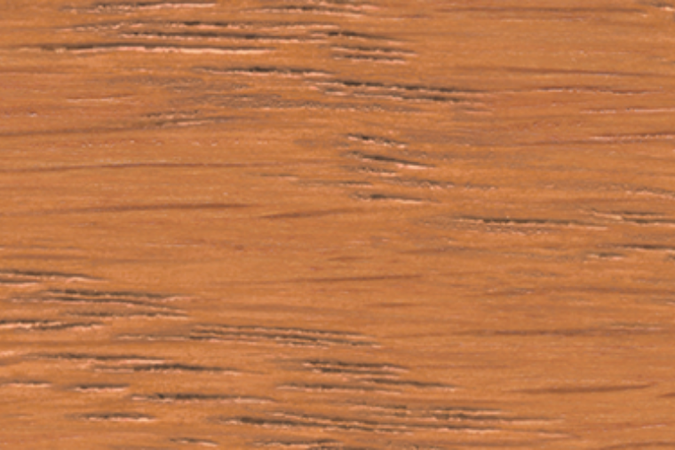 A close-up image of a vintage brown wood stain.