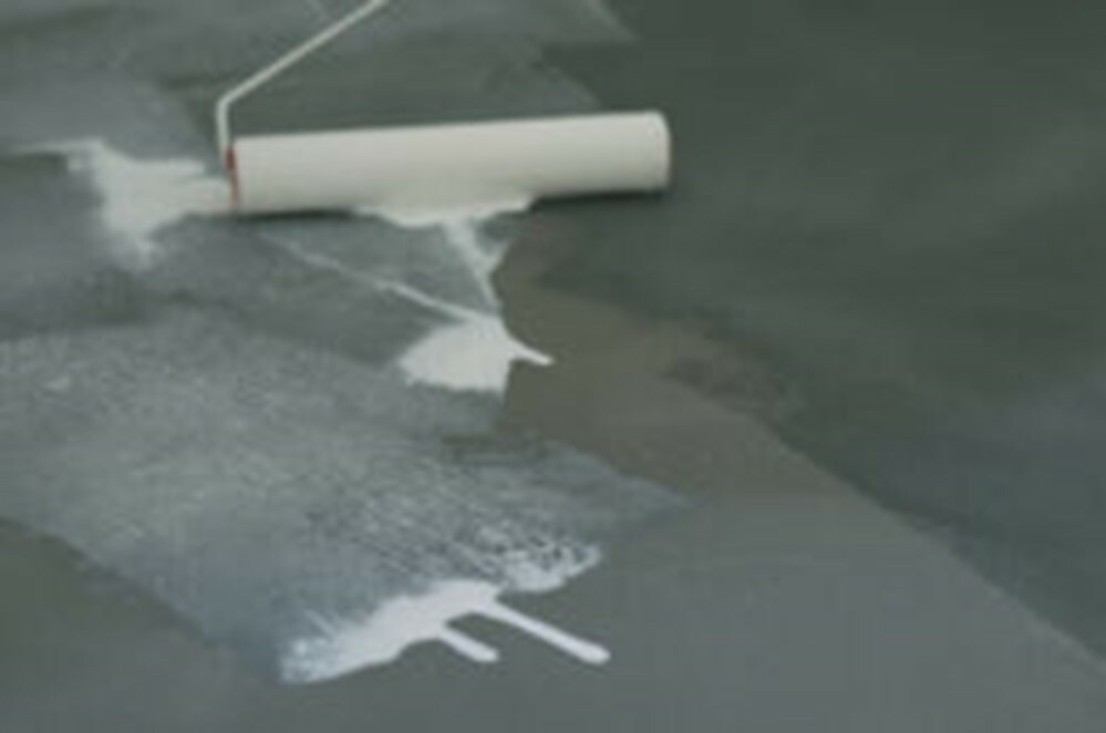 Rolling DRYLOK Floor and Wall on Concrete Floor